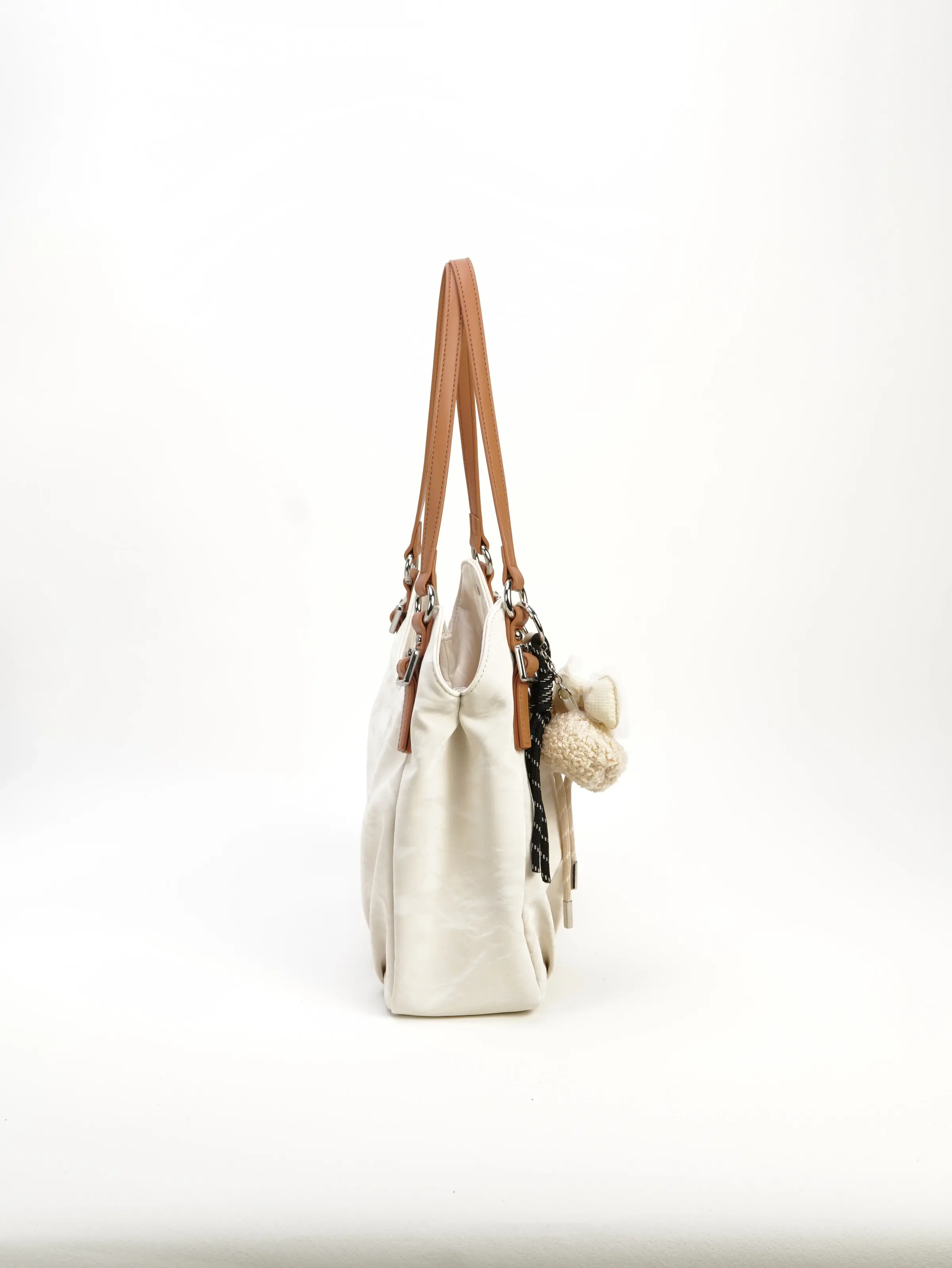 Elia ivory shoulder bag shown from the side